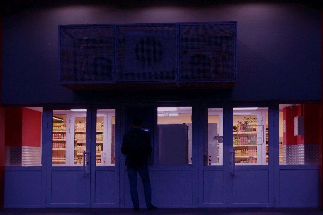 store detective watching customers